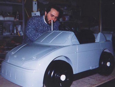 Working 
      
 
 
 
 on full-size ride-in toy car.